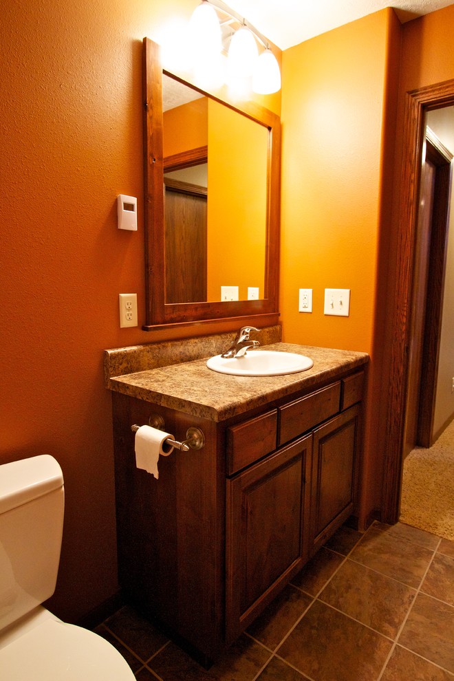 Bathroom - small master bathroom idea with a drop-in sink, raised-panel cabinets and laminate countertops