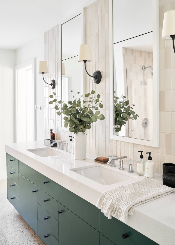 This is an example of a large midcentury master bathroom in Austin with flat-panel cabinets, green cabinets, white tile, white walls, terrazzo floors, a drop-in sink, white floor, white benchtops, a double vanity and a built-in vanity.