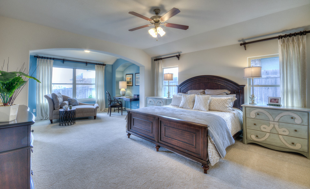 Example of a transitional bedroom design in Austin