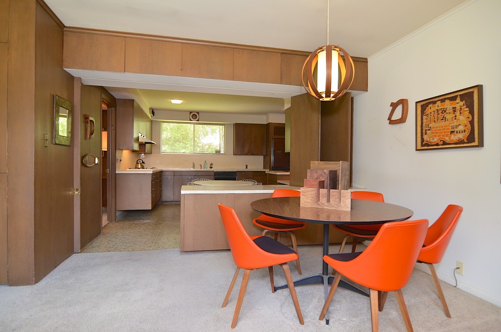 Design ideas for a midcentury kitchen/dining combo in Other with white walls and carpet.