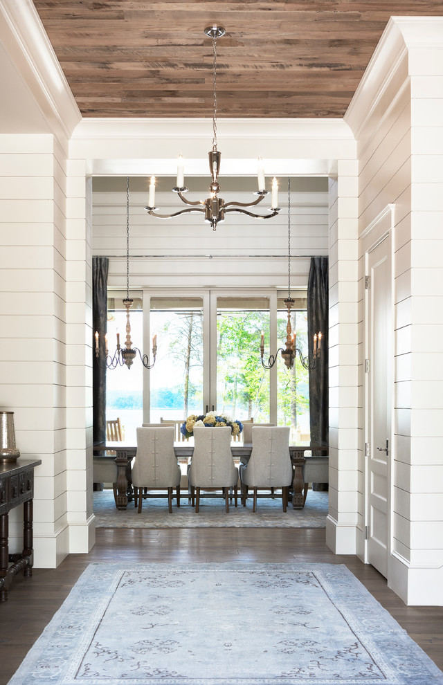 Photo of an expansive traditional dining room in Other with white walls and light hardwood floors.