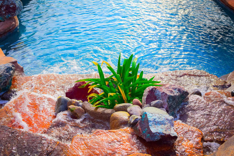 Example of a large transitional backyard concrete paver and custom-shaped hot tub design in Phoenix