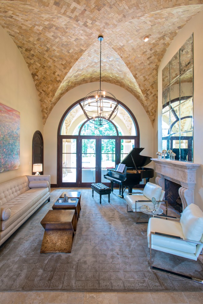Inspiration for a large mediterranean formal enclosed living room in Houston with beige walls, a standard fireplace, no tv, linoleum floors, a stone fireplace surround and brown floor.