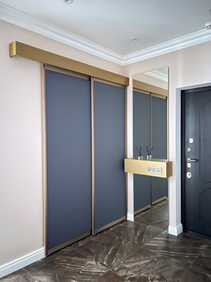 Contemporary entrance in Saint Petersburg with porcelain flooring, brown floors and wallpapered walls.