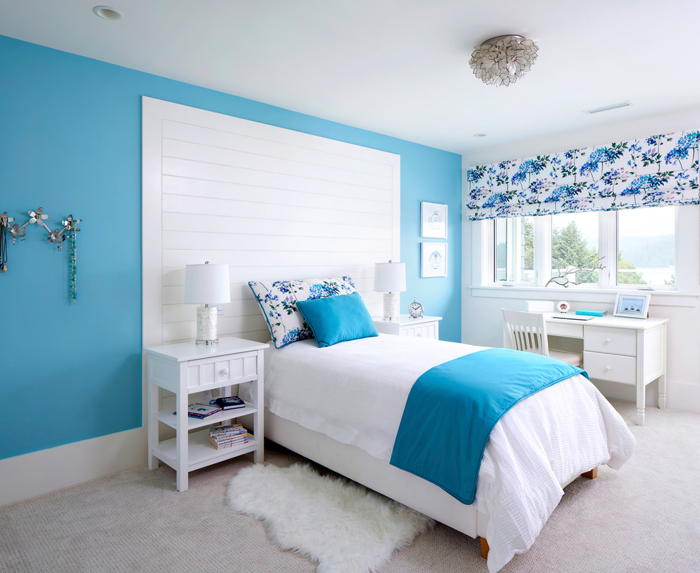 Example of a mid-sized beach style guest carpeted and beige floor bedroom design in Vancouver with blue walls and no fireplace
