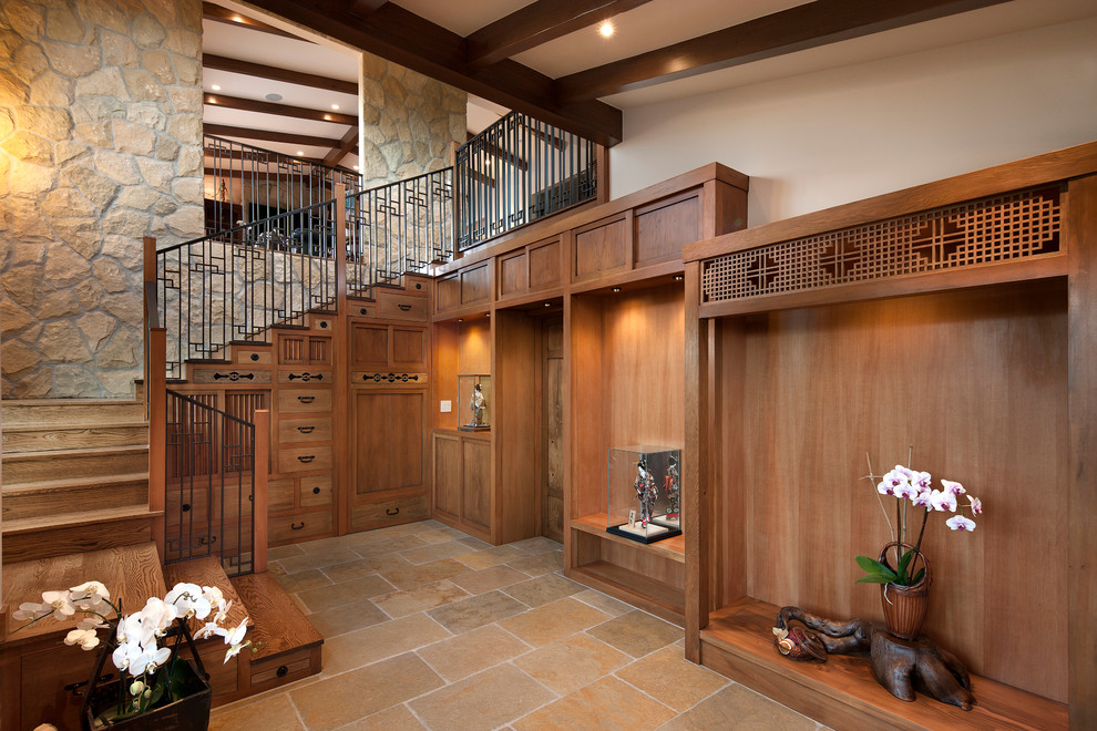 Design ideas for a mid-sized asian foyer in Santa Barbara with white walls and limestone floors.