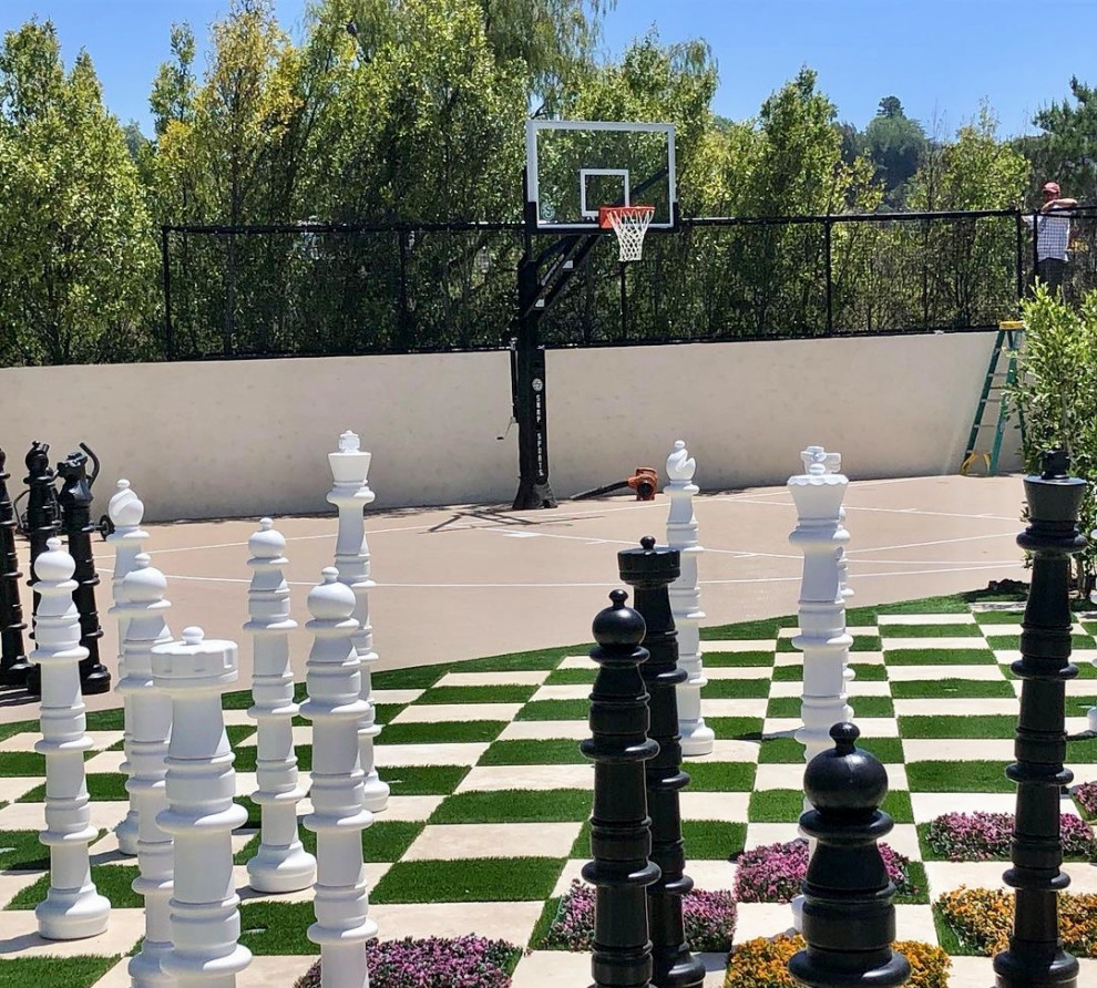 This is an example of a medium sized back garden in Orange County with an outdoor sport court.
