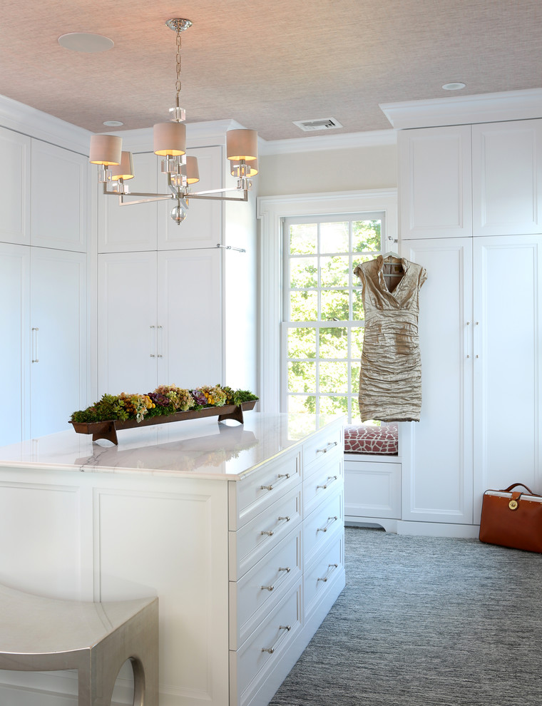Dressing room - large traditional gender-neutral carpeted and gray floor dressing room idea with white cabinets
