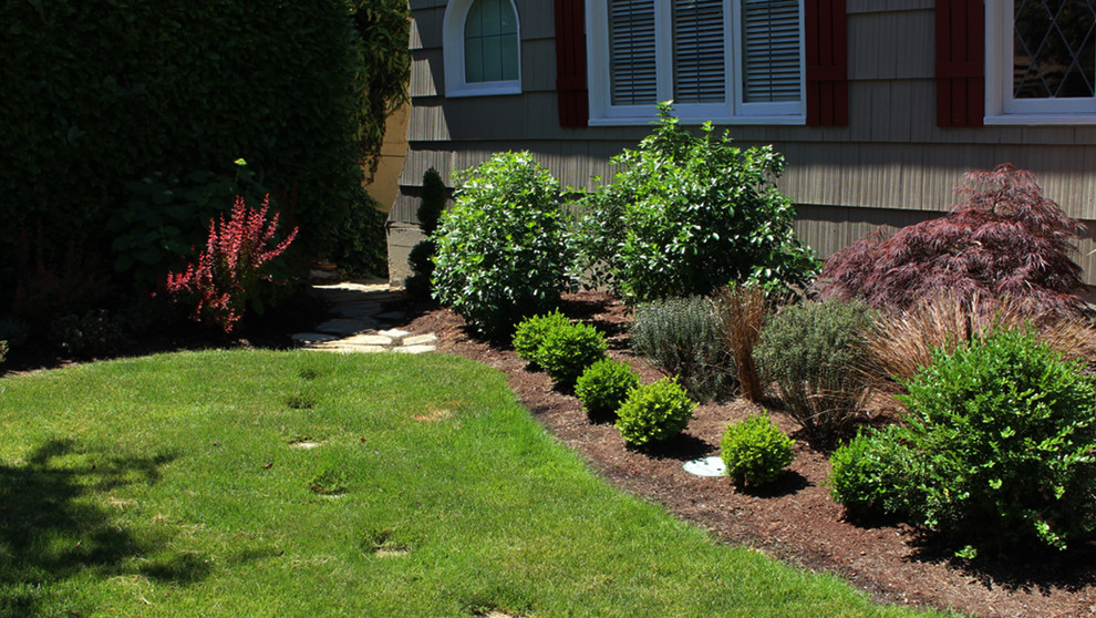 Design ideas for a large transitional partial sun backyard stone formal garden in Seattle for summer.