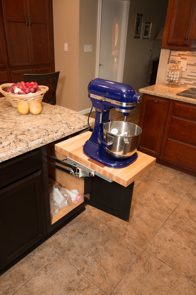 Inspiration for a large transitional u-shaped porcelain tile kitchen remodel with an undermount sink, flat-panel cabinets, medium tone wood cabinets, quartz countertops, beige backsplash, mosaic tile backsplash, stainless steel appliances and an island