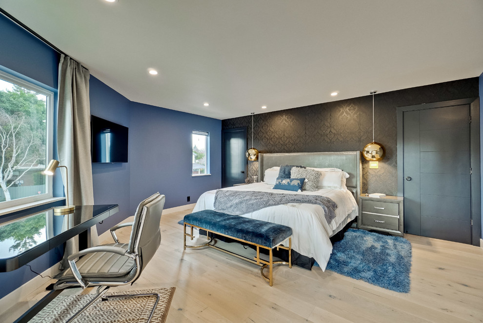 Contemporary bedroom in San Francisco with blue walls, light hardwood floors, no fireplace and beige floor.