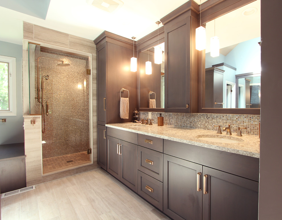 Inspiration for a large transitional master bathroom in Other with recessed-panel cabinets, grey cabinets, an alcove shower, a two-piece toilet, multi-coloured tile, glass sheet wall, grey walls, limestone floors, an undermount sink, engineered quartz benchtops, grey floor, a hinged shower door and beige benchtops.