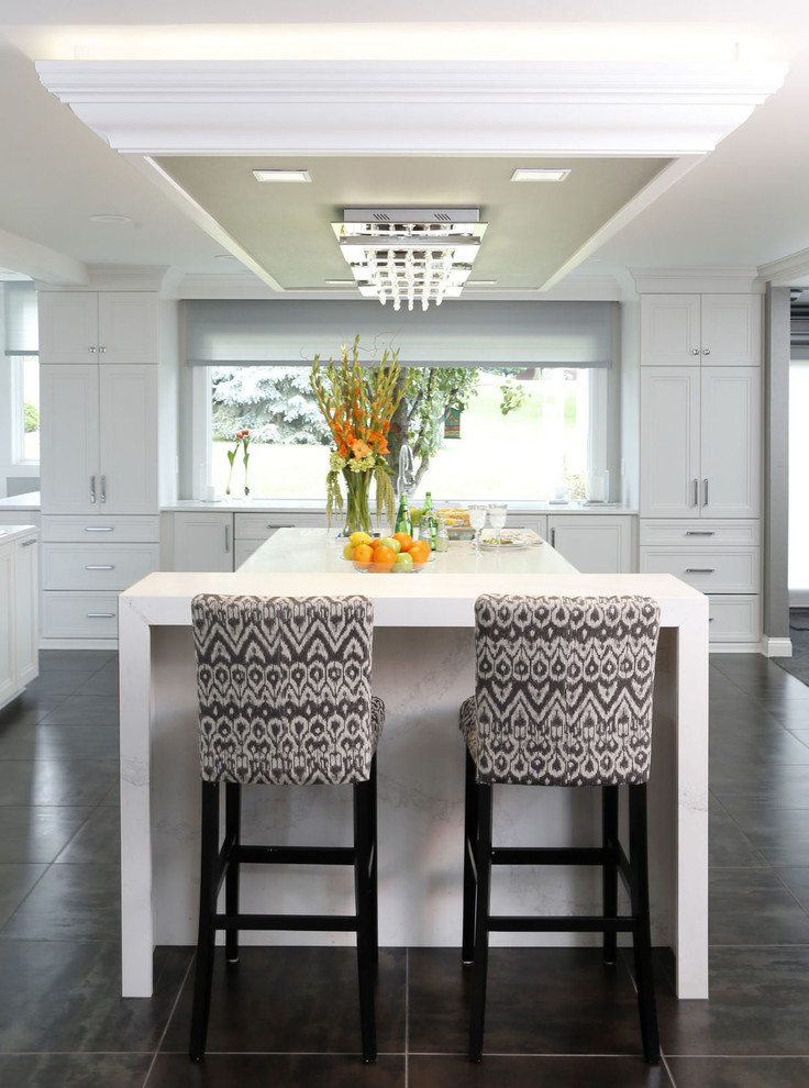 Inspiration for a transitional porcelain tile and gray floor kitchen remodel in Cedar Rapids with recessed-panel cabinets, white cabinets and glass countertops