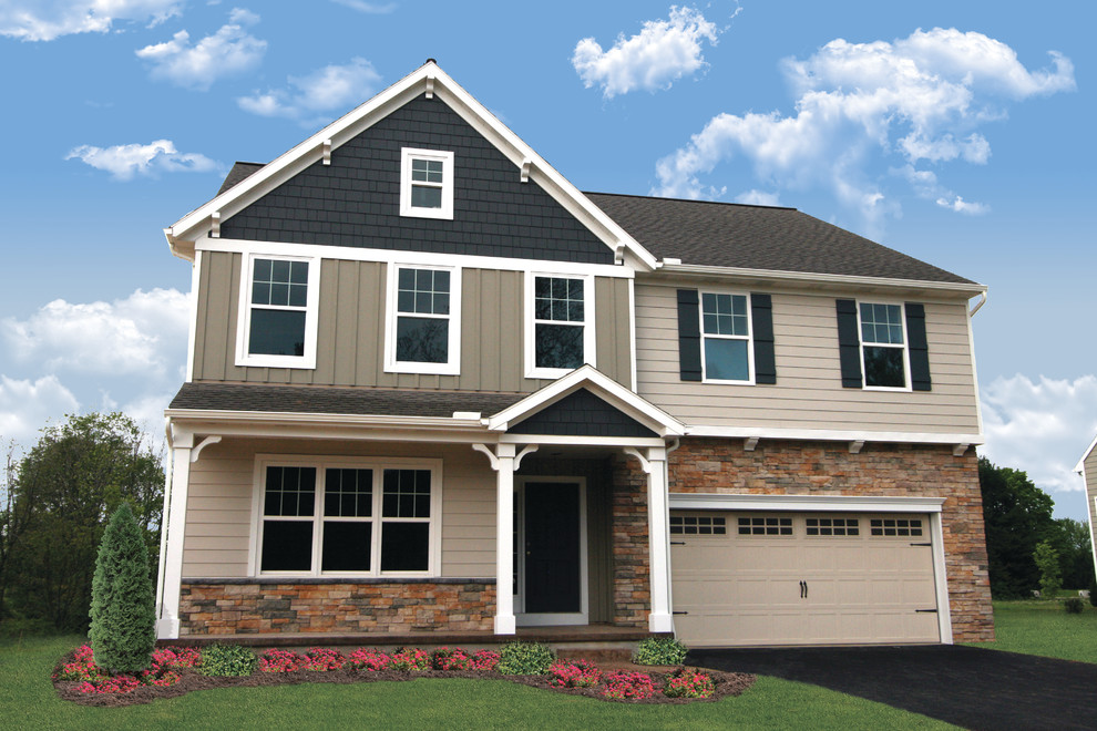 Mid-sized elegant two-story beige home design photo