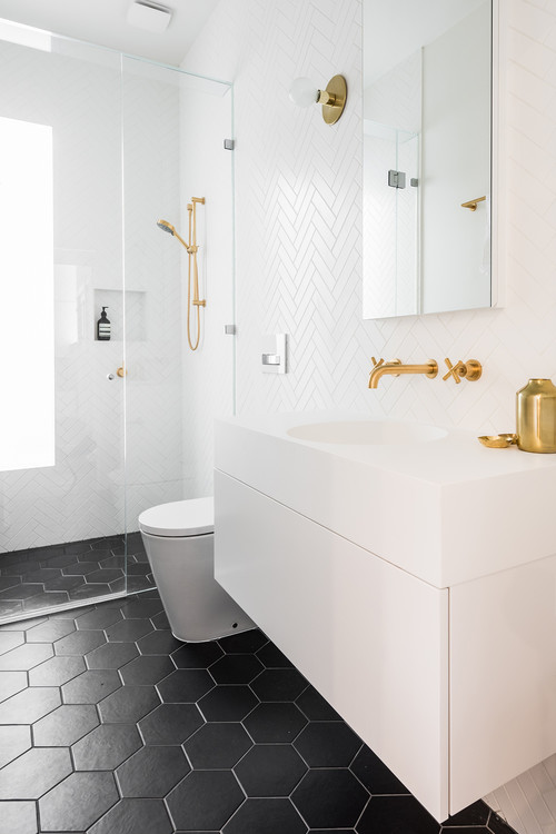 Contrast Elegance: White Bathroom, Gold Fixtures, and Black Floor