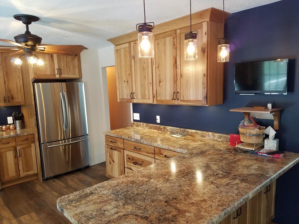 Mid-sized country u-shaped separate kitchen in Chicago with a double-bowl sink, shaker cabinets, medium wood cabinets, granite benchtops, blue splashback, stainless steel appliances, medium hardwood floors, with island, brown floor and beige benchtop.