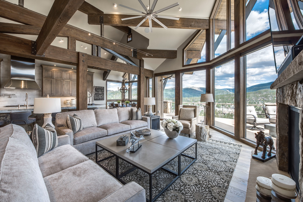 Example of a transitional living room design in Denver