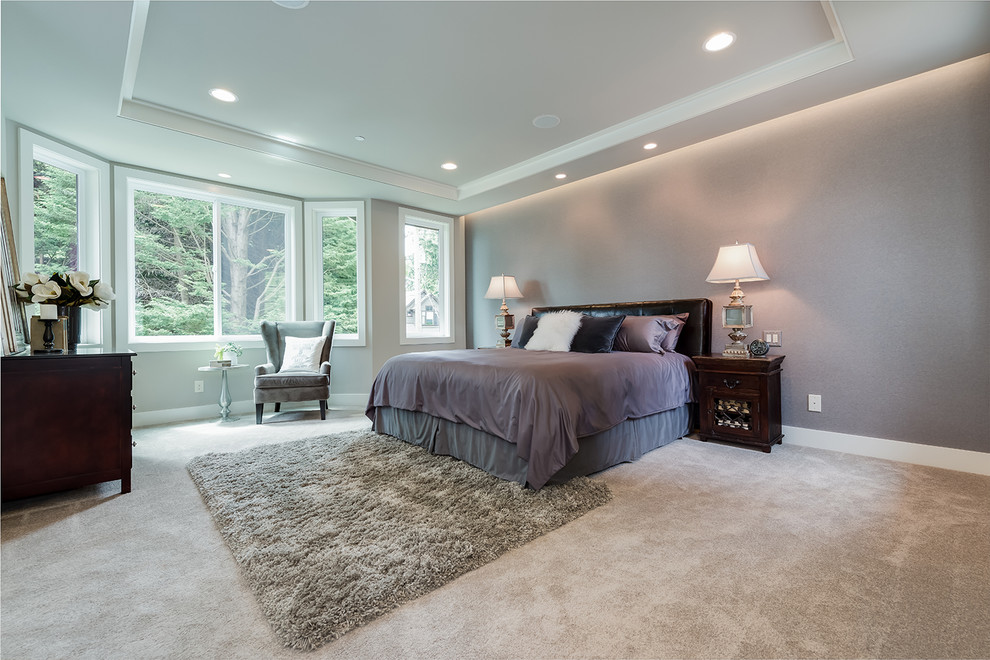 Large transitional master bedroom in Seattle with grey walls, carpet and no fireplace.