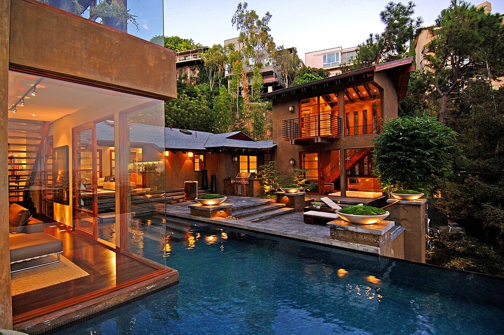 Photo of a large contemporary backyard patio in Los Angeles with no cover.