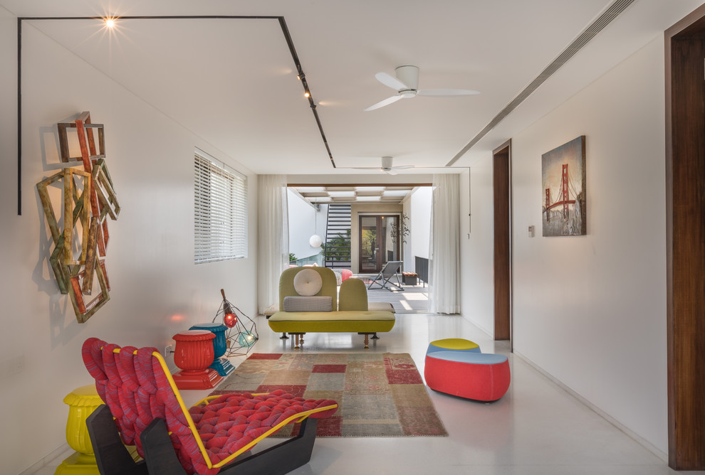 Mid-sized eclectic hallway in Hyderabad with white walls.