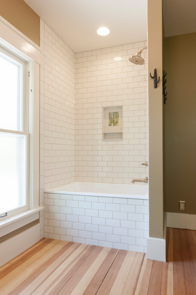 Design ideas for a medium sized classic family bathroom in Chicago with flat-panel cabinets, medium wood cabinets, a built-in bath, a shower/bath combination, a one-piece toilet, white tiles, metro tiles, brown walls, light hardwood flooring, a trough sink, brown floors, a shower curtain, a laundry area, a single sink and a built in vanity unit.