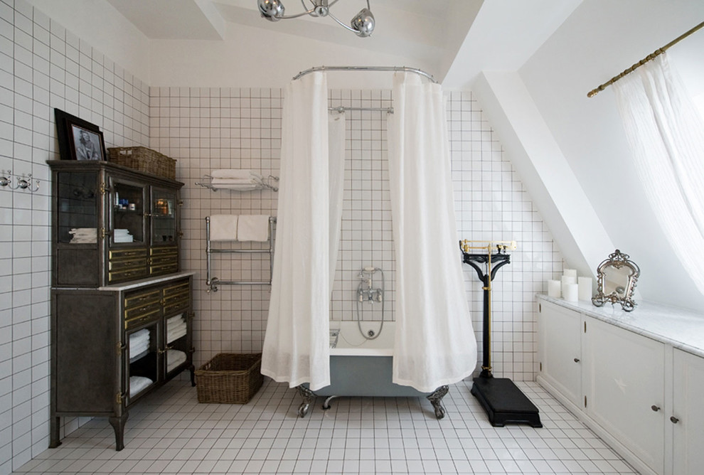 Inspiration for a large traditional master bathroom in London with a shower/bathtub combo and white walls.