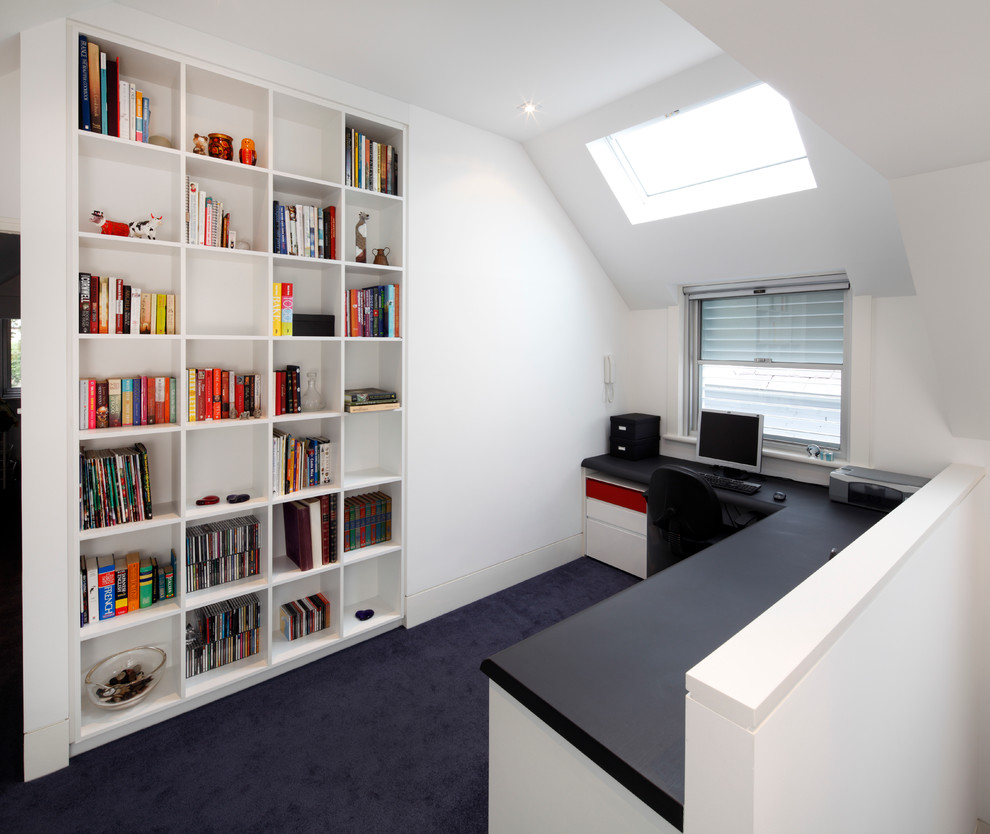 This is an example of a modern study room in Sydney with white walls, carpet, no fireplace and a built-in desk.