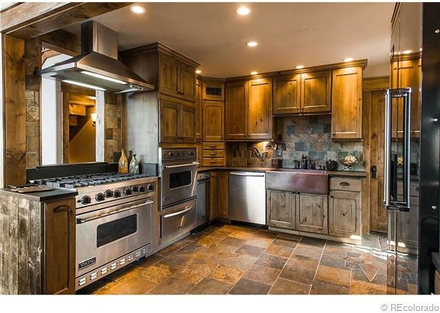 Example of a mountain style kitchen design in Denver