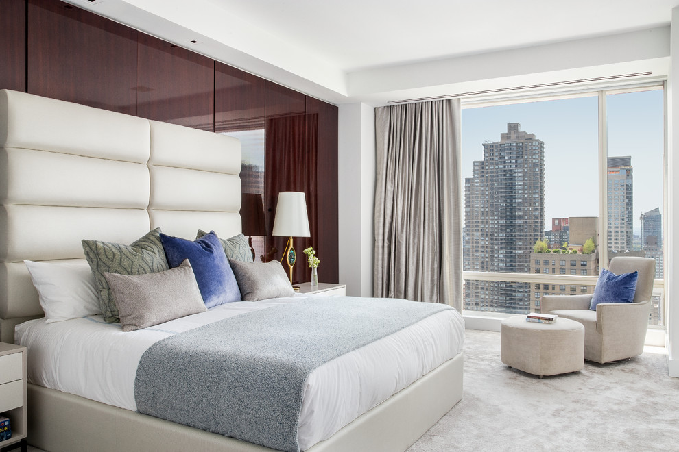 Photo of a contemporary master bedroom in New York with carpet, no fireplace and beige floor.
