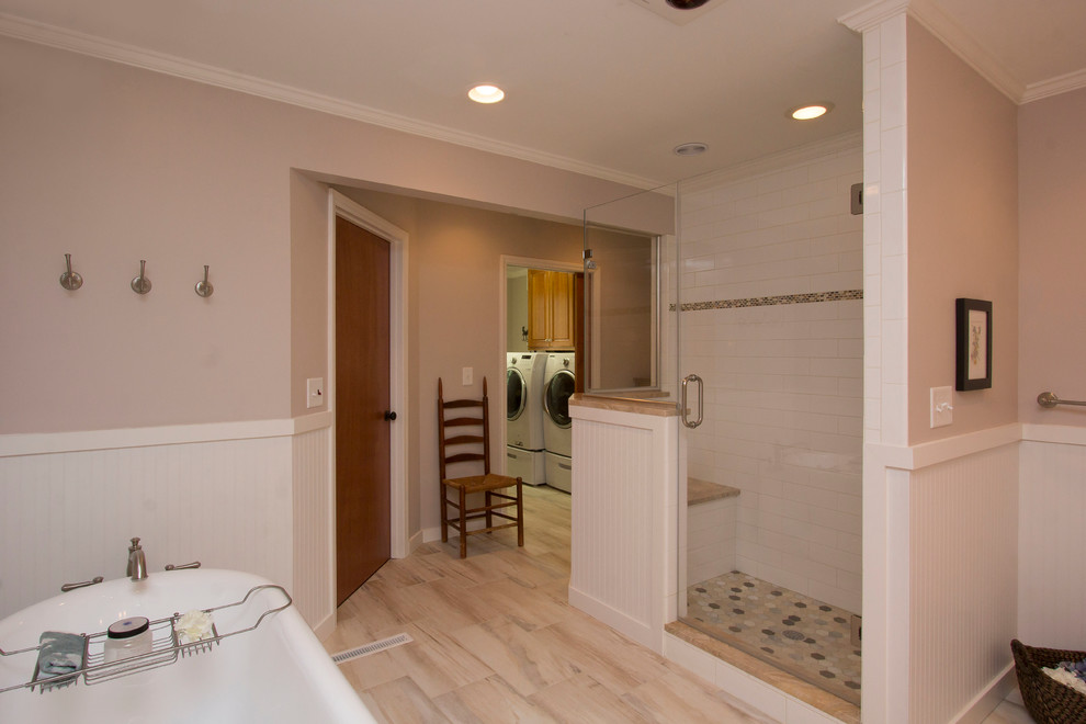 This is an example of a large transitional master bathroom in Raleigh with an undermount sink, white cabinets, marble benchtops, a freestanding tub, a corner shower, a two-piece toilet, white tile, ceramic tile, beige walls, porcelain floors, shaker cabinets, orange benchtops, multi-coloured floor and a hinged shower door.