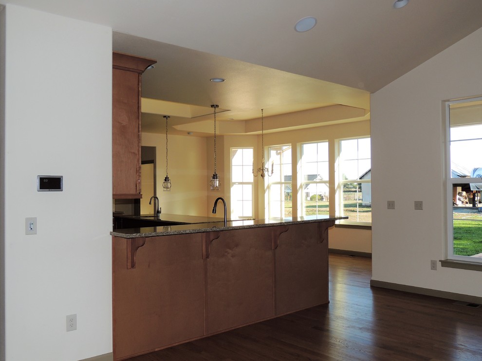 Eat-in kitchen - large transitional u-shaped light wood floor eat-in kitchen idea in Seattle with recessed-panel cabinets, medium tone wood cabinets, quartzite countertops, multicolored backsplash, mosaic tile backsplash, stainless steel appliances and an island