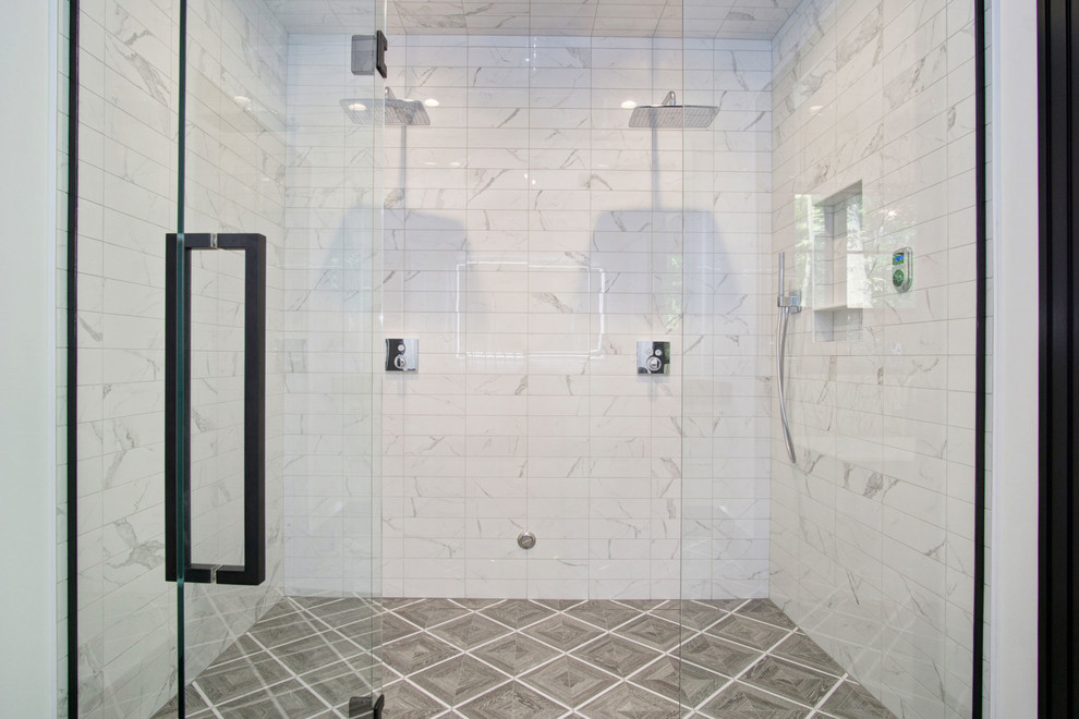 Design ideas for an eclectic master bathroom in Grand Rapids with flat-panel cabinets, a freestanding tub and a curbless shower.