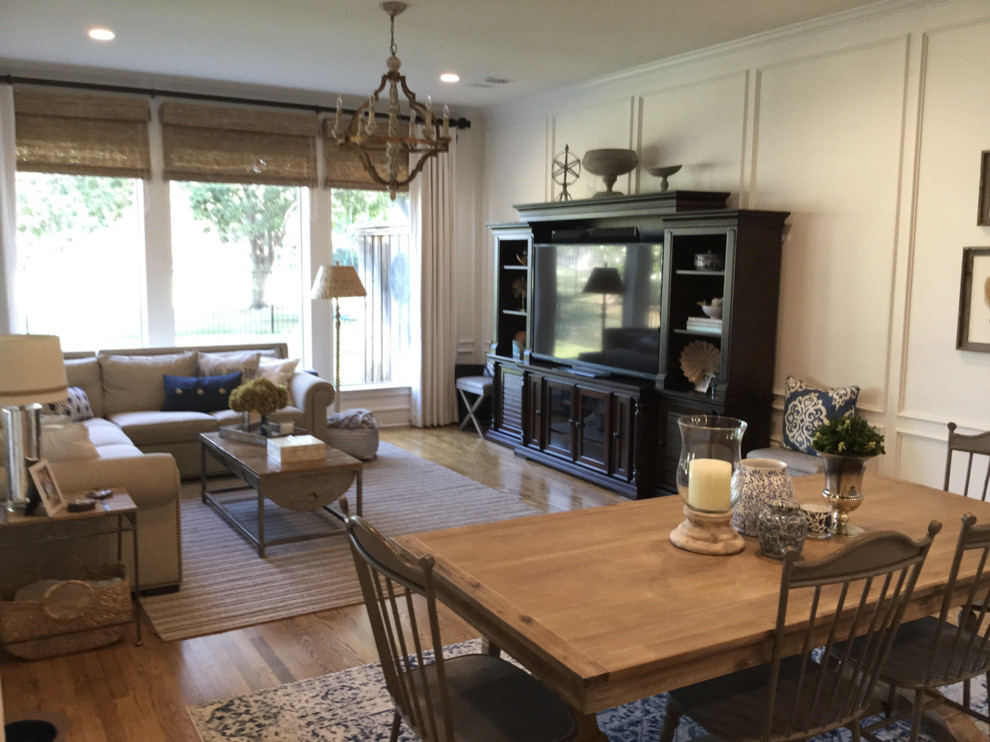 Mid-sized transitional open concept family room in Dallas with grey walls, medium hardwood floors, no fireplace and brown floor.