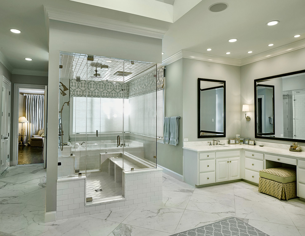 Expansive transitional bathroom with white cabinets, an alcove tub, white tile, stone slab, green walls, marble floors, an undermount sink, marble benchtops and with a sauna.