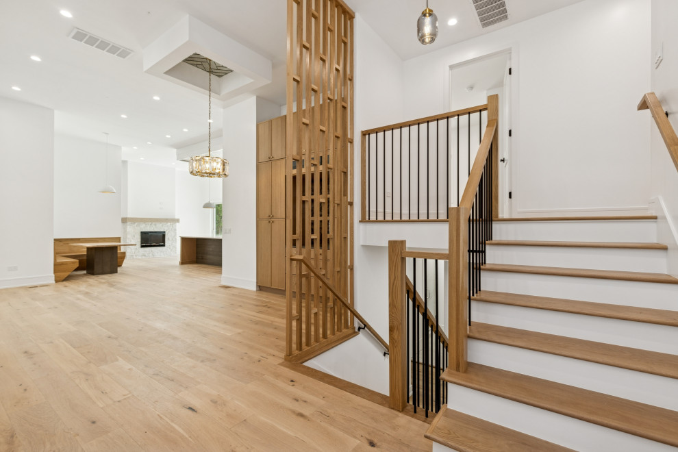 Sculptural Staircase with Vertical Slat Screen & Oak Flooring