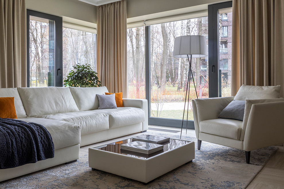 Contemporary formal open concept living room in Moscow with beige walls, porcelain floors and beige floor.