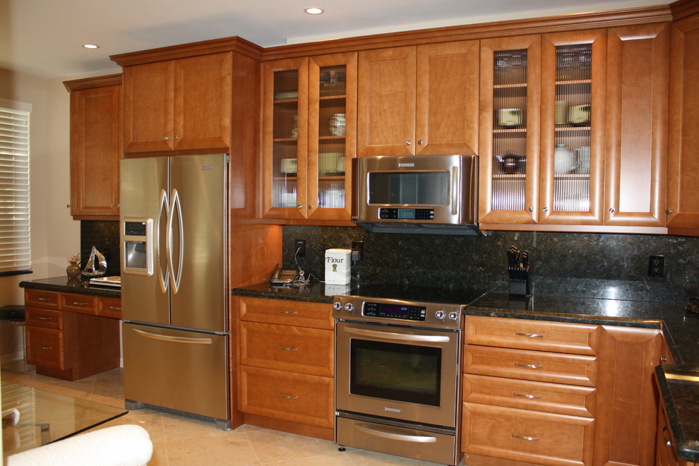 Example of a large transitional u-shaped dark wood floor eat-in kitchen design in Miami with an undermount sink, raised-panel cabinets, medium tone wood cabinets, granite countertops, white backsplash, stone slab backsplash, stainless steel appliances and an island