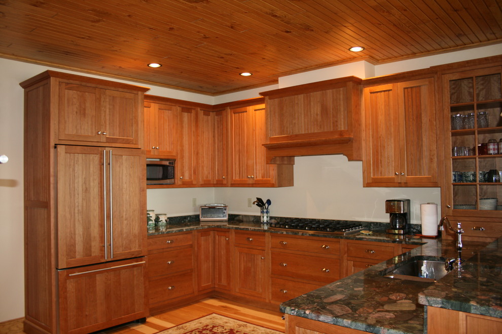 Large mountain style u-shaped medium tone wood floor eat-in kitchen photo in Boston with a double-bowl sink, shaker cabinets, medium tone wood cabinets, a peninsula and colored appliances