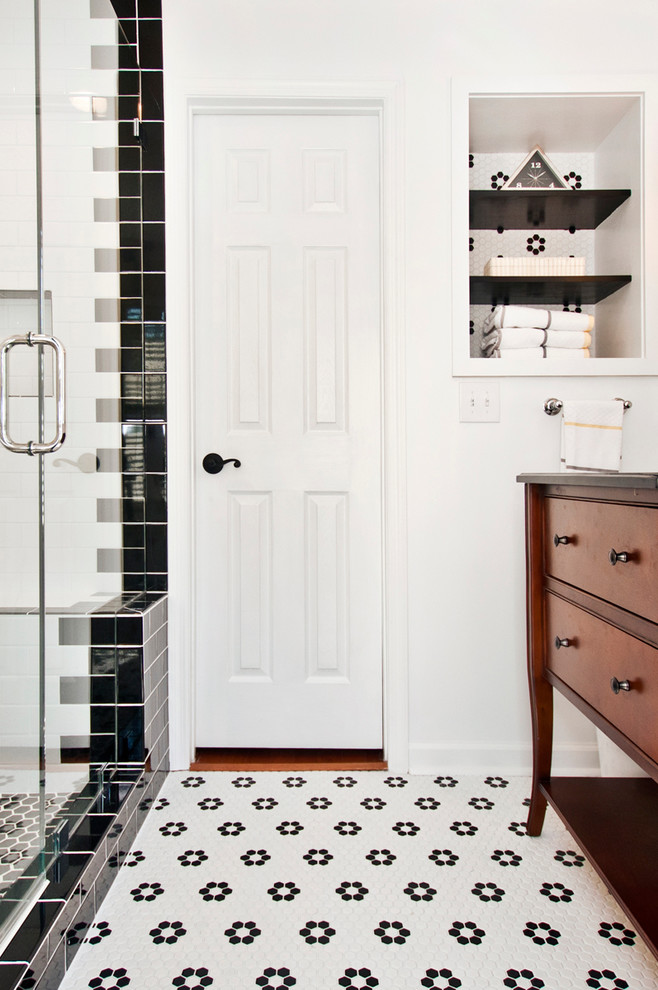 Inspiration for a mid-sized eclectic master bathroom in Nashville with furniture-like cabinets, dark wood cabinets, an alcove shower, a two-piece toilet, black and white tile, ceramic tile, white walls, ceramic floors, an undermount sink and granite benchtops.