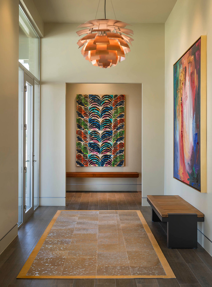 Design ideas for an expansive midcentury entryway in Austin with beige walls and porcelain floors.