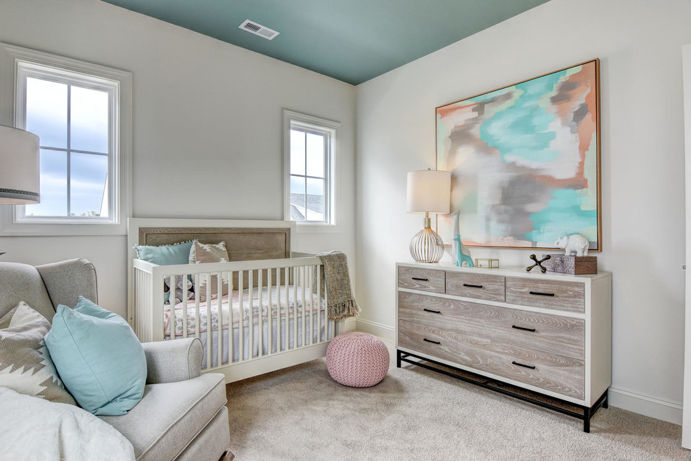 Inspiration for a mid-sized transitional gender-neutral nursery in Other with white walls, carpet and beige floor.