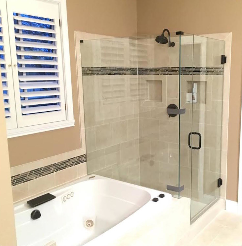This is an example of a medium sized classic ensuite bathroom in Cincinnati with a built-in bath, a corner shower, beige tiles, stone tiles, brown walls and porcelain flooring.