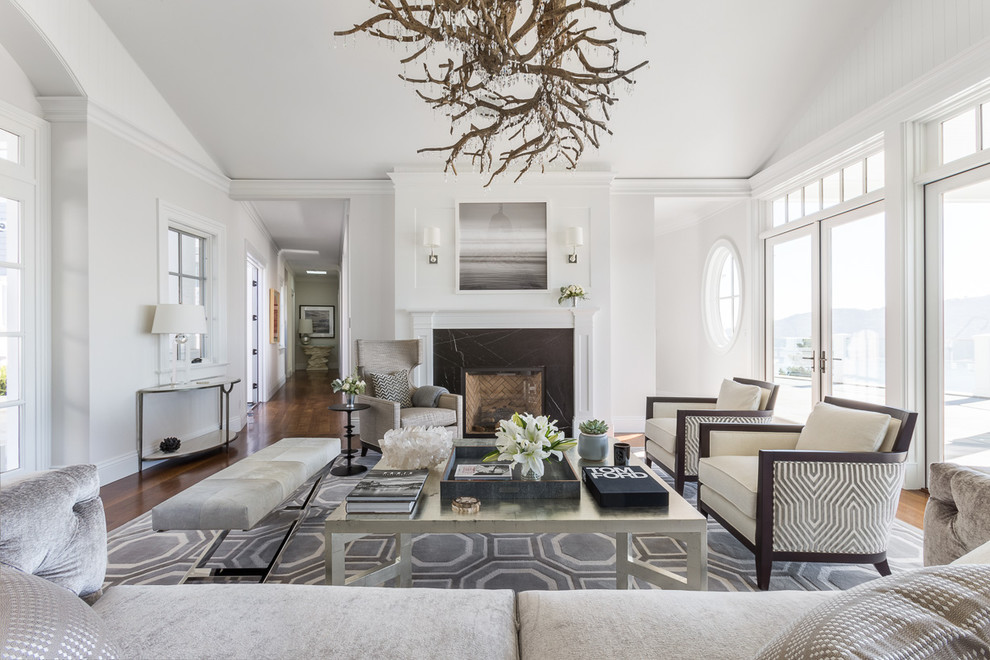 Photo of a large transitional formal open concept living room in San Francisco with white walls, medium hardwood floors, a standard fireplace, no tv and a stone fireplace surround.