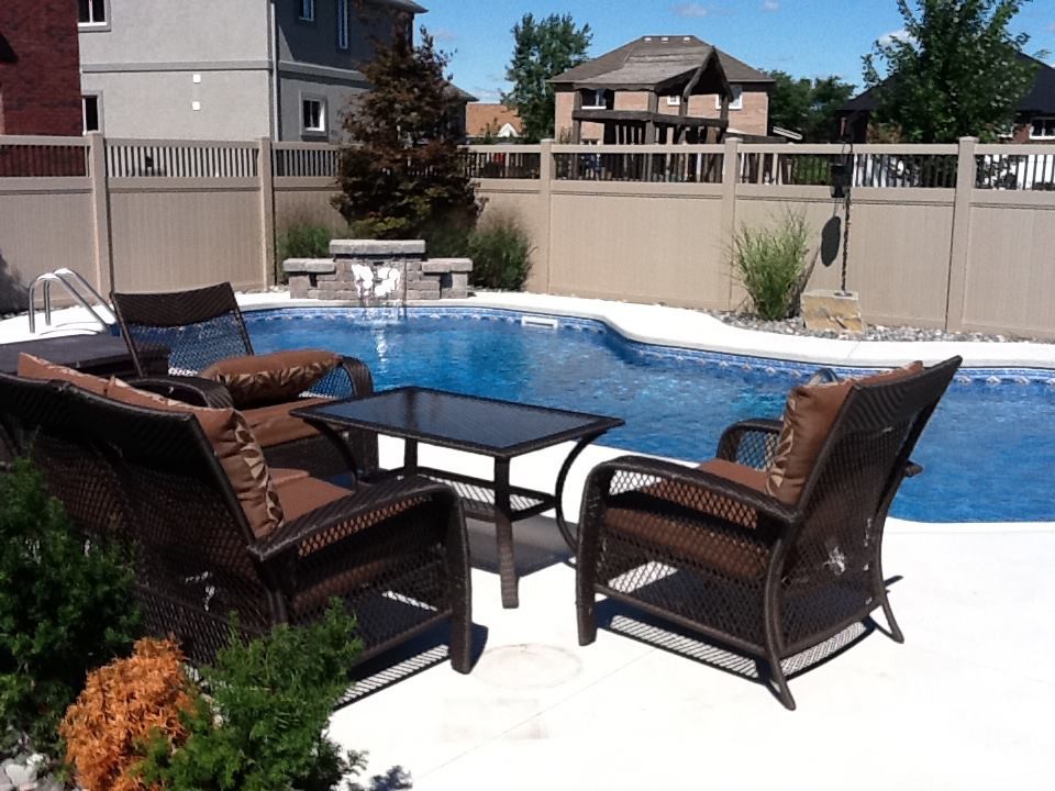 Pool - large backyard stone pool idea in Toronto