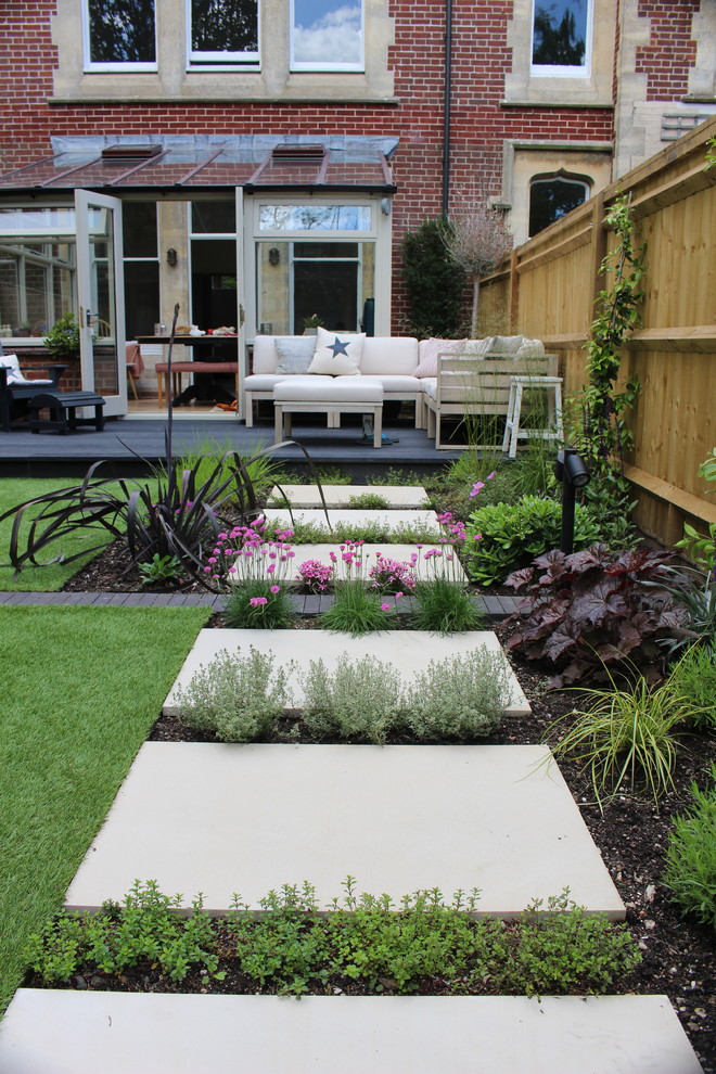 Inspiration for a small contemporary backyard partial sun formal garden for summer in Hampshire with decking.