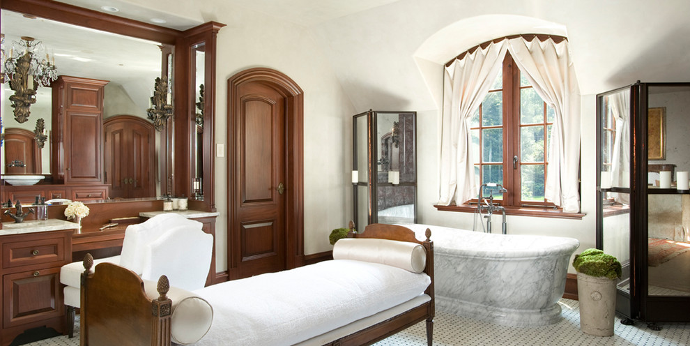 Inspiration for a traditional bathroom in Philadelphia with dark wood cabinets and a freestanding tub.