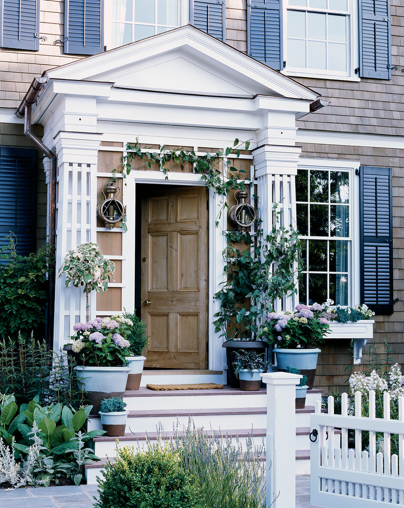 Traditional front door in New York with a single front door and a medium wood front door.