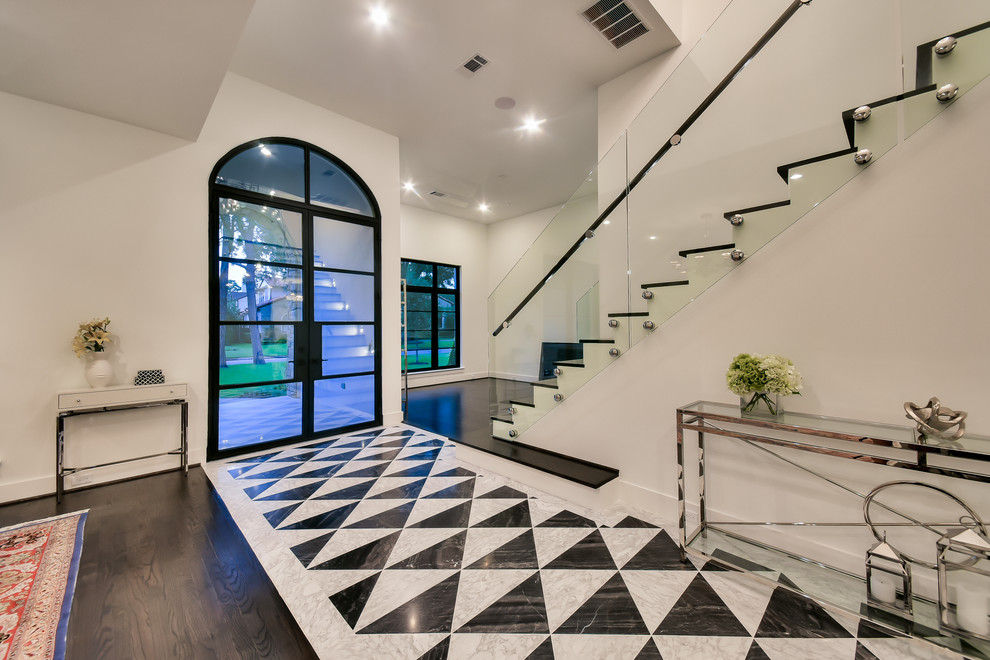 Mid-sized contemporary foyer in Houston with white walls, marble floors, a double front door, a glass front door and multi-coloured floor.