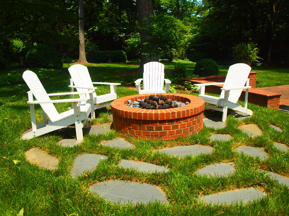 Traditional backyard garden in Charlotte with a fire feature.