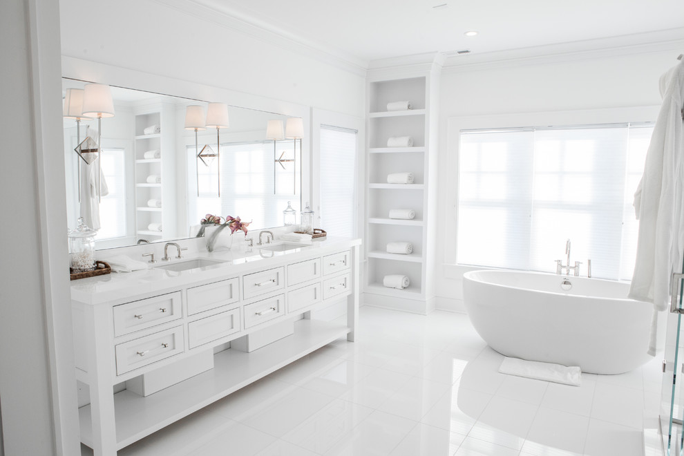 Large transitional master white floor freestanding bathtub photo in Bridgeport with beaded inset cabinets, white cabinets, white walls and an undermount sink